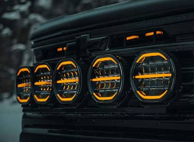 Phare longue portée LEDs Orange / Blanc Nuuk D-Line 9 pouces 10-32V sur voiture